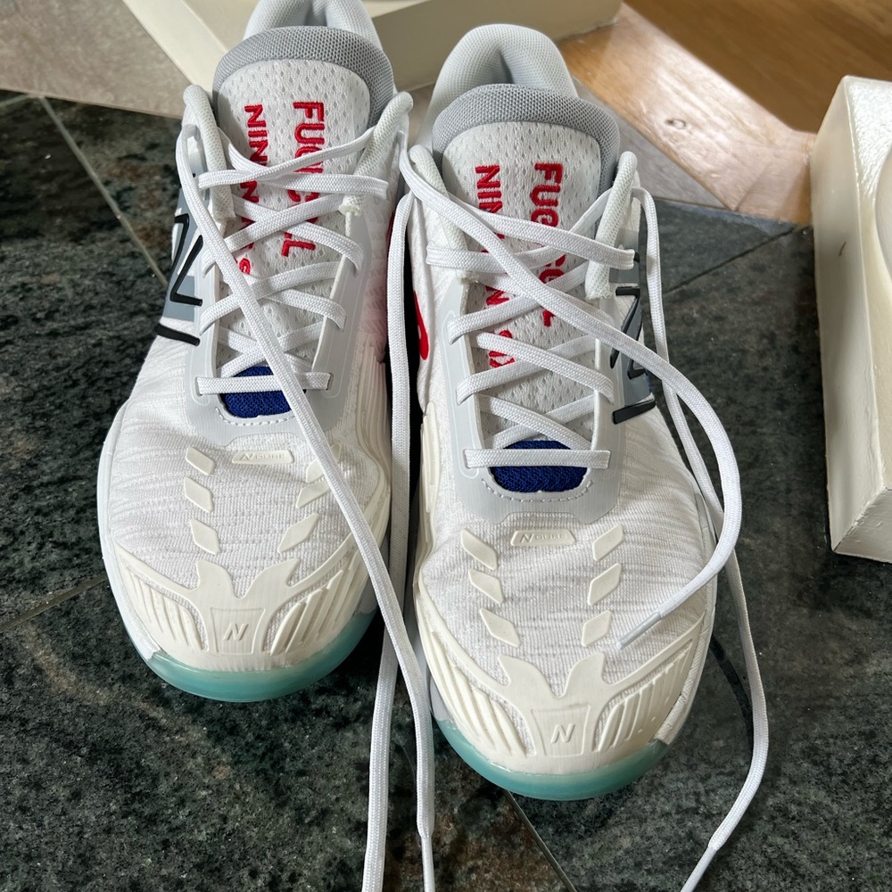 New Balance White and Blue Sneakers